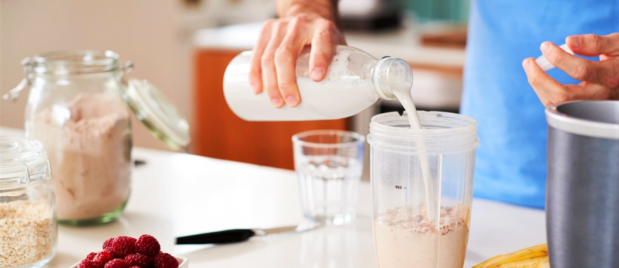 close-up-of-man-making-protein-shake-after-exercise-at-homeclose-up-of-man-making-protein-shake-after-exercise-at-home